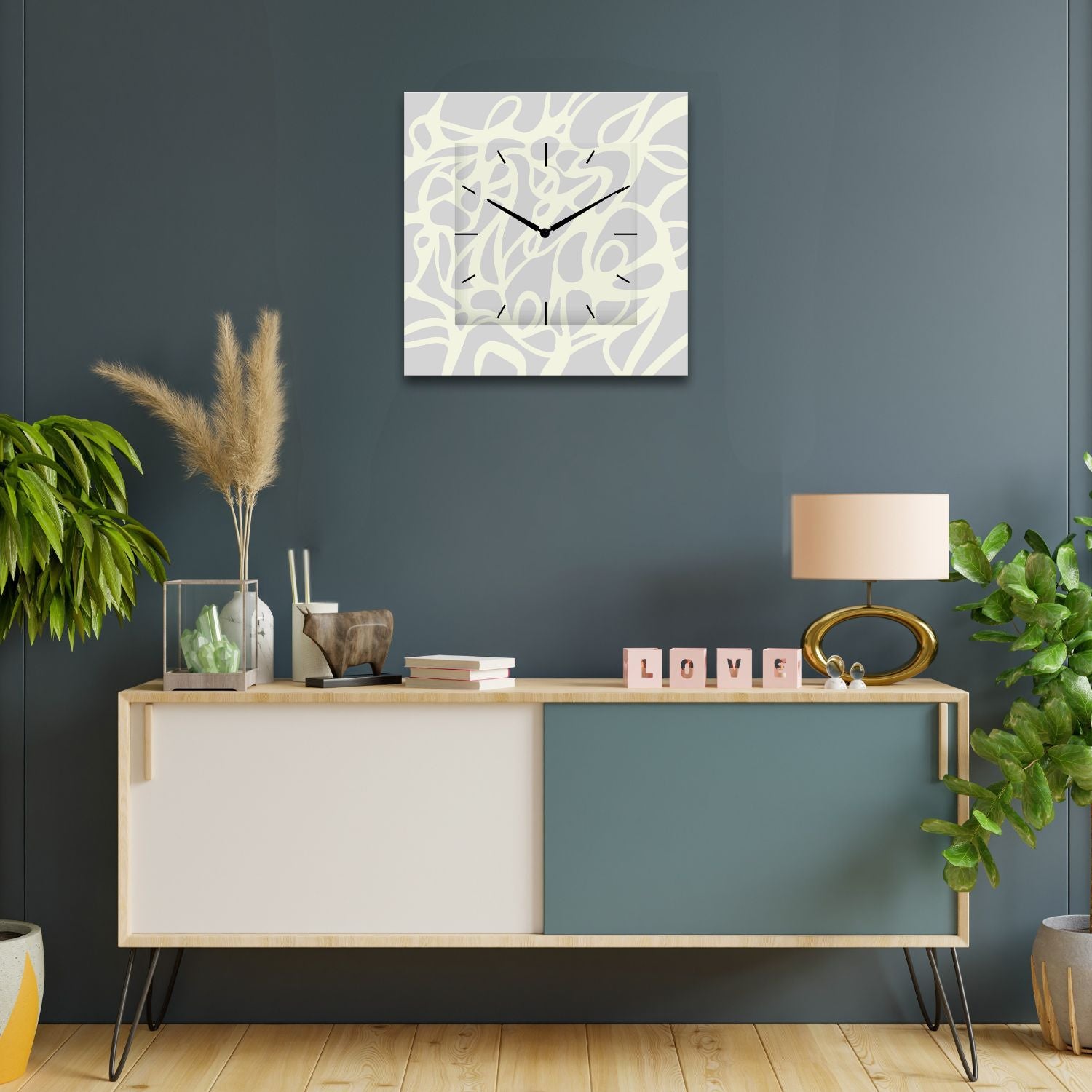 orologio da parete quadrato astratto ambientato sopra un mobile moderno
