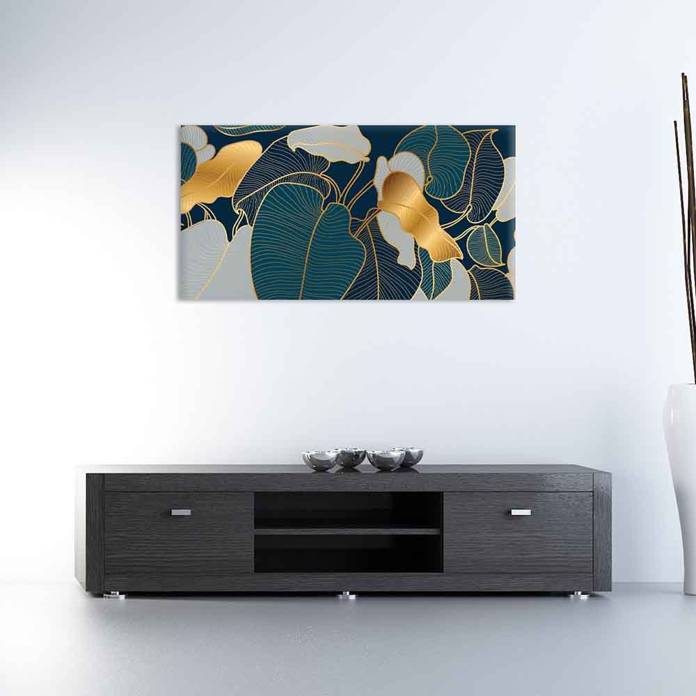 Quadro in vetro decorato moderno plexiglass o vetro con foglie dorate su fondo blu scuro, appeso in soggiorno moderno con mobile basso antracite.