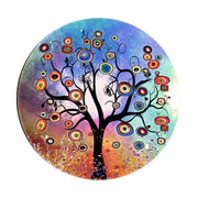 Magnete in legno con albero nero su sfondo arcobaleno, rami ricchi di fiori concentrici colorati e forme vivaci.