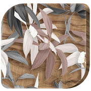 Magnete in legno d'ulivo con decorazione di foglie stilizzate in diverse forme e sfumature, evocando la natura e la bellezza organica.