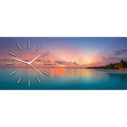 Orologio in plexiglass con decorazione di un tramonto su una spiaggia tropicale, evocando relax e atmosfera esotica.