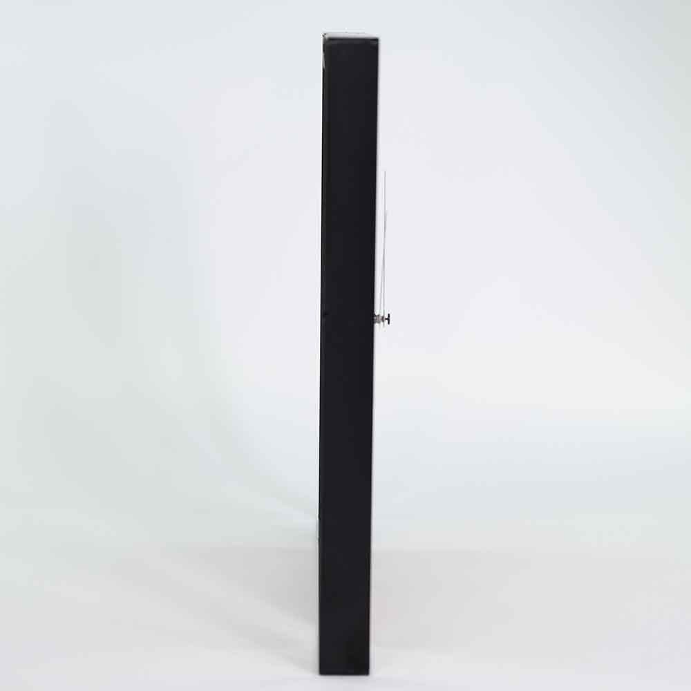 Vista laterale dell'orologio ulivo acciaio da parete, con focus sulla perfetta integrazione dei materiali.