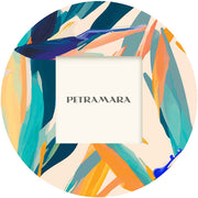 Portafoto vetro rotondo con decorazione di fiori di sterlizia, un tocco floreale elegante.