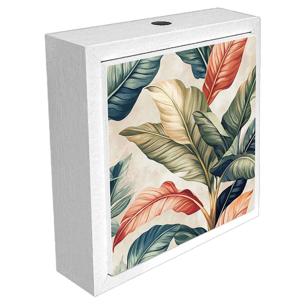 Profumatore ceramica bianco con motivi ispirati alla natura tropicale, foglie e forme esotiche. Vista laterale che valorizza i dettagli decorativi.