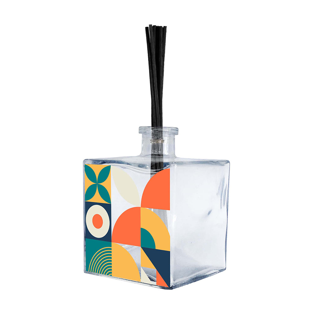 Profumatore ambiente vetro trasparente quadrato, decoro geometrico Bauhaus con petali, cerchio, semicerchi e archi in turchese arancio e navy, reed neri