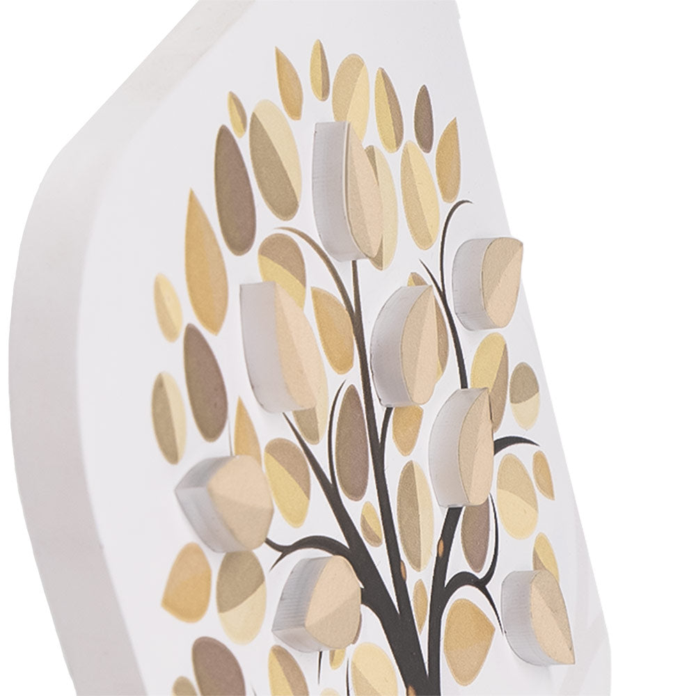 Primo piano sul decoro in rilievo di foglie sovrapposte su albero nero, evidenziando la tridimensionalità del quadretto in legno.