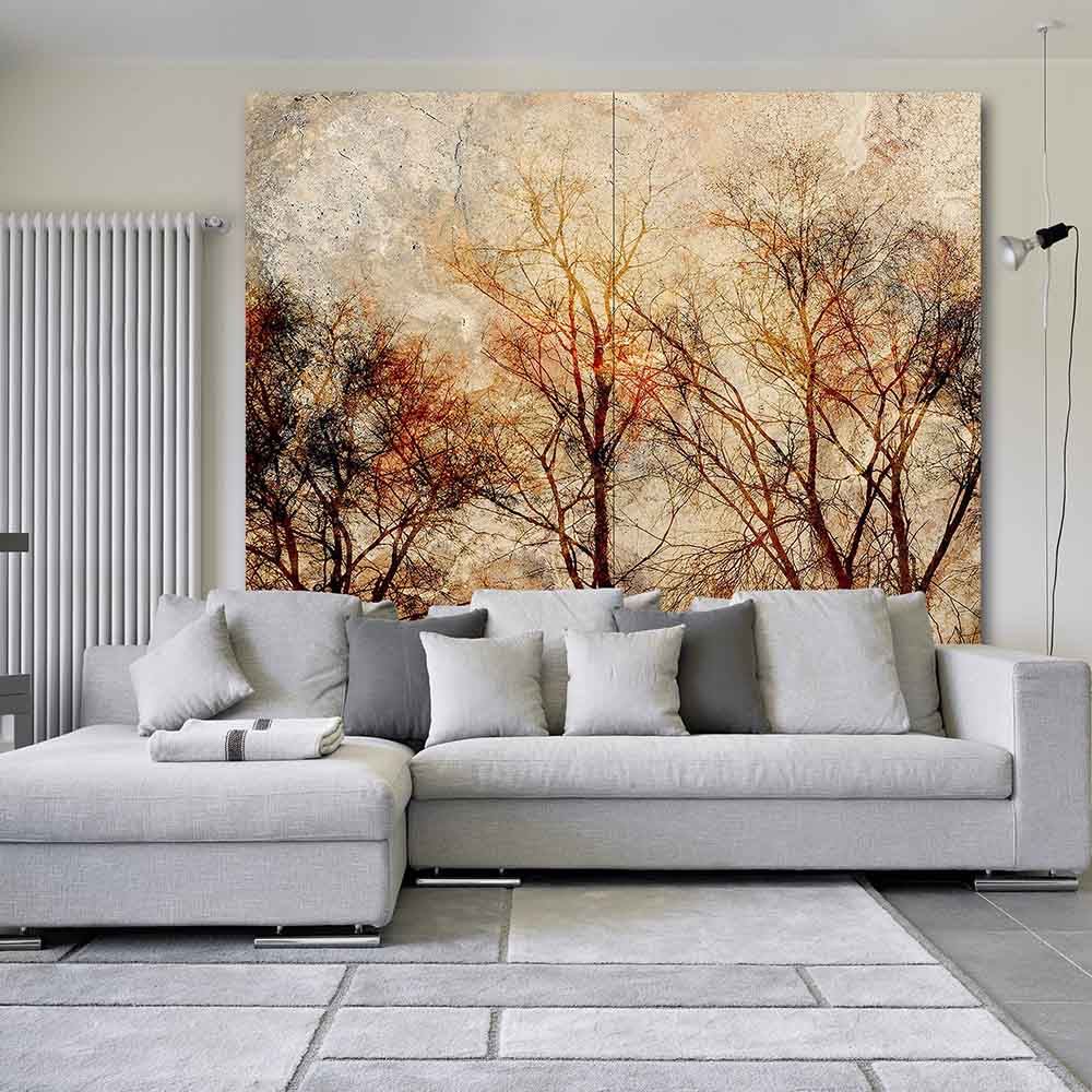 Quadro su tela grande con elegante composizione di foglie in tonalità terrose, valorizzato in un soggiorno raffinato.