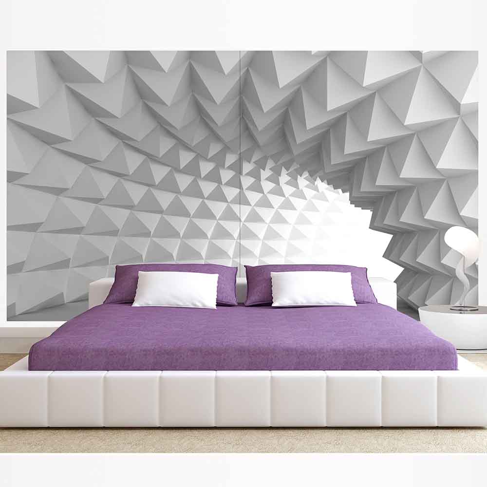 Quadro su tela grande con pattern geometrico 3D, aggiungendo un tocco moderno a una camera minimalista.